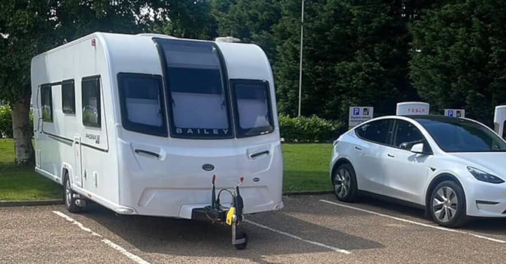 EV towing caravan, on charge. Picture copyright Jason Dunks.
